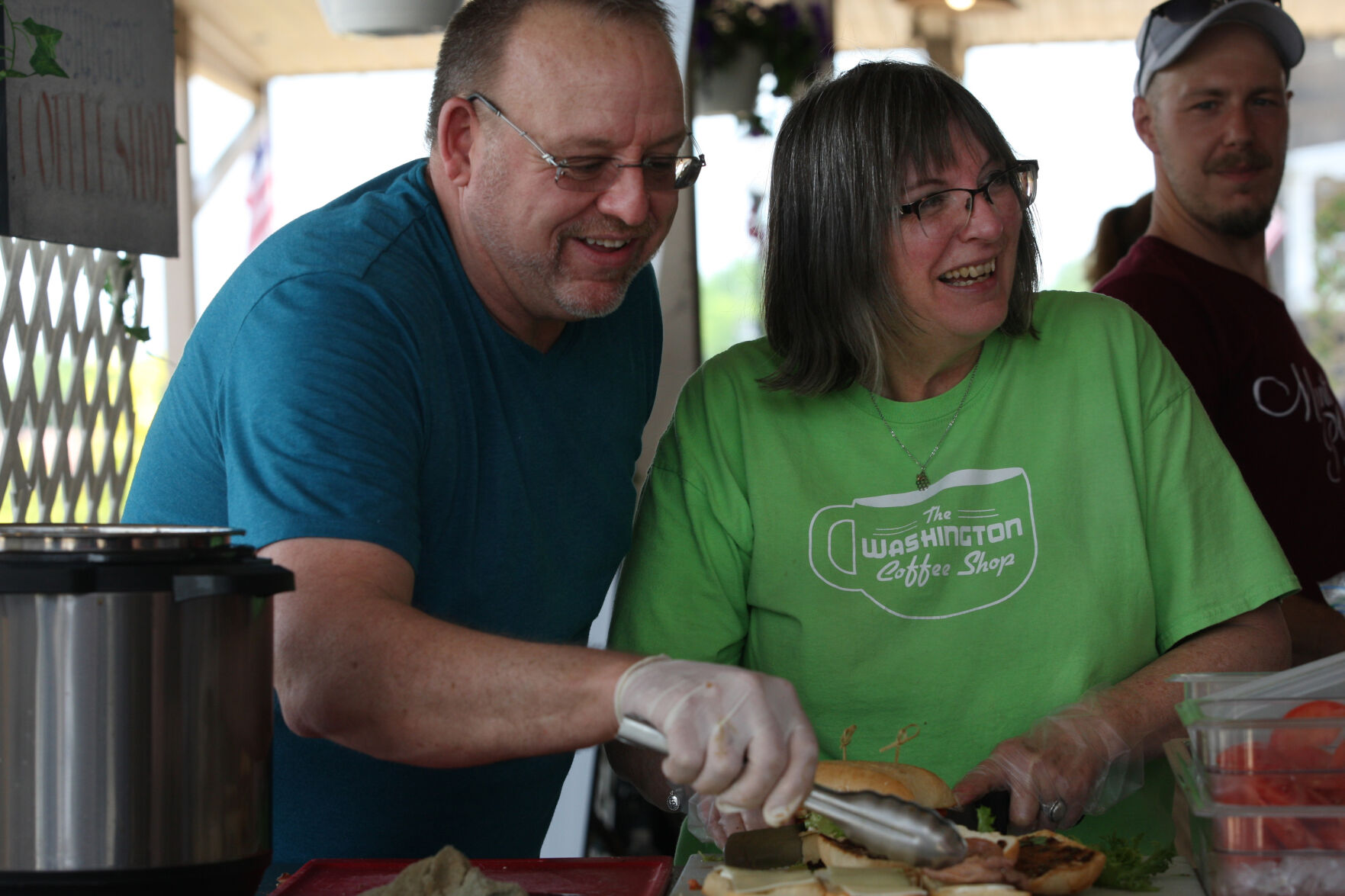 Dale Schotte and Barb Baue prepare roast beef sandwiches
